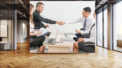 successful handshake of two businessmen at office Wall mural