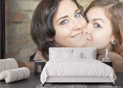 Two happy girls make selfie on camera or mobile phone Wall mural