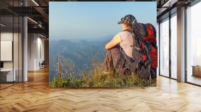 young woman in the mountains at sunset Wall mural