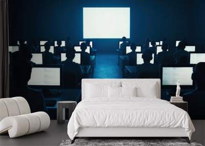 group of individuals focused on their computer screens in dimly lit room, creating atmosphere of concentration and teamwork. bright screen in front adds stark contrast to dark surroundings, enhancing Wall mural