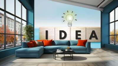 wood cubes with idea text on blue background Wall mural