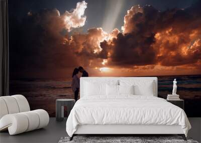 Couple in love at a fiery sunset.Silhouette photo Wall mural