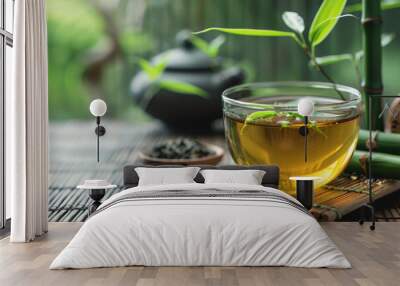 A cup of bamboo leaf tea on a wooden table on a nature background, a big copy space Wall mural