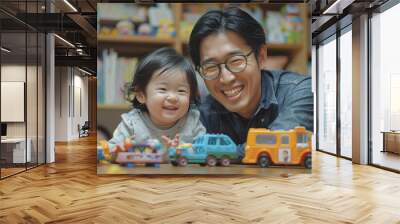 A father happily teaches his children to play with toys inside the house. Wall mural