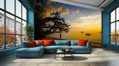 amazing landscape of sea and tropical beach in Thailand at sunset time for vacation(selective focus at oarsman and boat) Wall mural