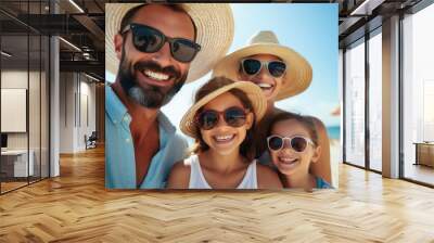 A man and two girls wearing sun glasses on the beach Wall mural