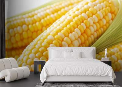 Ears of bright yellow and white corn are gathered, showcasing their fresh appearance, perfect for summer cooking Wall mural