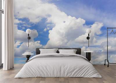 White cumulus clouds in blue sky at daytime. Natural background photo texture Wall mural