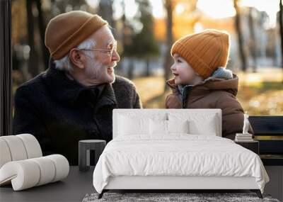 Family enjoying a park outing in autumn, featuring a parent with their child, a grandfather with his grandson, and moments of joy and togetherness Wall mural