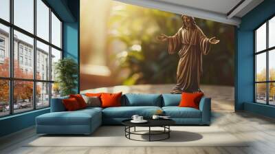 A small bronze statue of Jesus with open arms, placed on a marble surface with soft lighting from a nearby window. Focus on the statue. No people. Wall mural