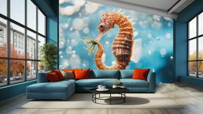 A seahorse clutching a piece of seaweed in its tail, set against a backdrop of clear blue water, with bubbles rising gently to the surface. Wall mural