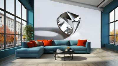 A silver ring with a geometric design displayed on a minimalist background. Wall mural