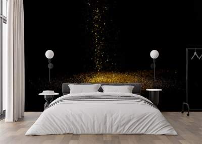 Sprinkle gold dust on a black background with copy space. Wall mural