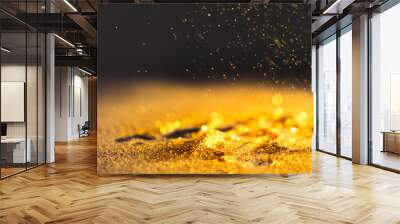 Sprinkle gold dust on a black background with copy space Wall mural