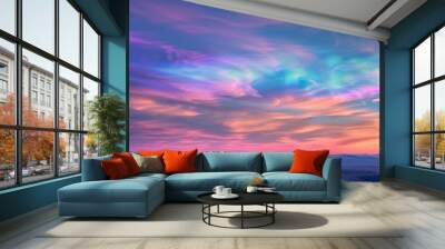 Nacreous clouds, iridescent and glowing at high altitudes, ethereal and colorful, in a polar region sunrise Wall mural