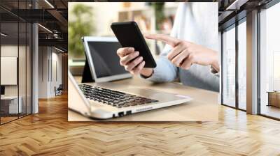 Girl hands using multiple devices on a desk Wall mural