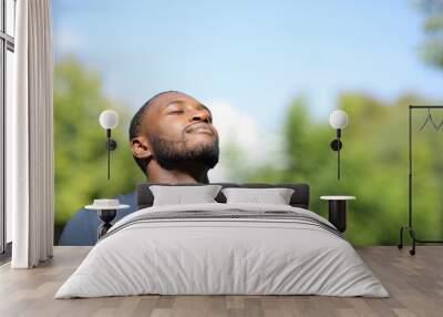 man with black skin breathing in nature Wall mural