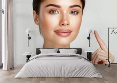 Beautiful young woman with fresh clean skin on white background with copy space. Face care, cosmetology, beauty treatment and spa concept. Wall mural