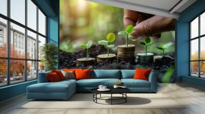 hand holding money savings filled with coins and growing plant for sustainable financial planning fo Wall mural