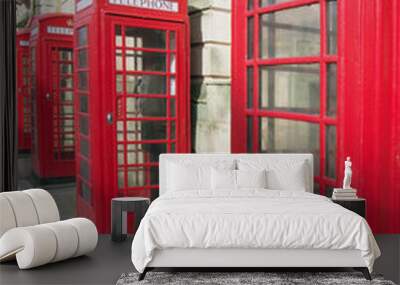 a line of typical old fashioned british red public telephone boxes outside the former post office in Blackpool Lancashire Wall mural