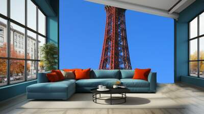 A vertical view of Blackpool tower in bright sunlight against a bright blue summer sky Wall mural