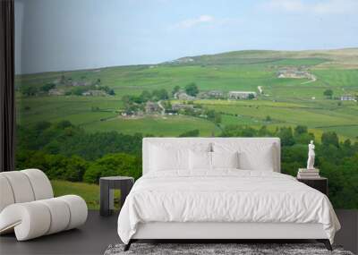 west yorkshire dales scenery with farmhouses perched on high hills with typical walled fields and midgley moor in the distance with blue sunlit summer sky with farmhouses in the pecket well area Wall mural