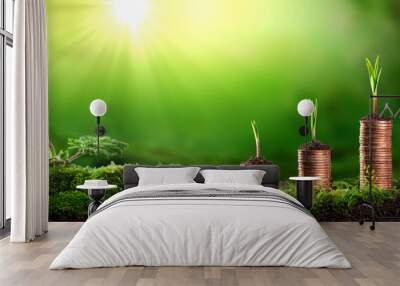  Young Plants Growing Out Of Stacks Of Coins In Lush Mossy Garden - Investing / Business Success Concept Wall mural