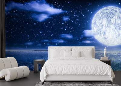 Romantic Moon With Clouds And Starry Sky Over Sparkling Blue Water Wall mural