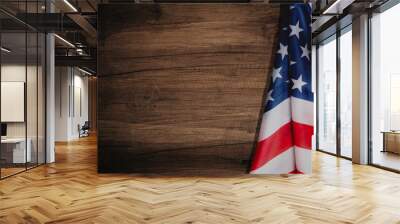 Top view overhead America United States flag, memorial remembrance and thank you of hero, studio shot with copy space on wooden table background, USA holiday Veterans or Independence day concept. Wall mural