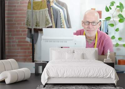 a middle-aged man in a sewing workshop Wall mural