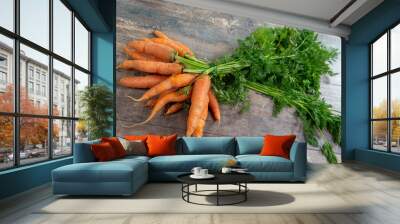 Fresh and sweet carrot on wooden background Wall mural