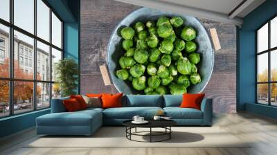 fresh raw brussels sprouts on wooden table Wall mural