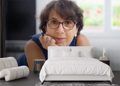 portrait of a mature woman with glasses Wall mural