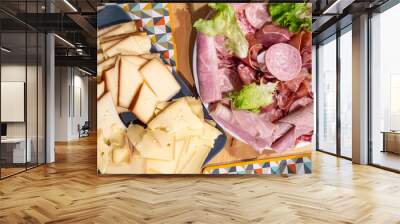 Raclette cheese and meat, french tradition Wall mural