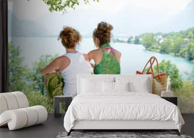 two lesbians in nature admire the landscape Wall mural