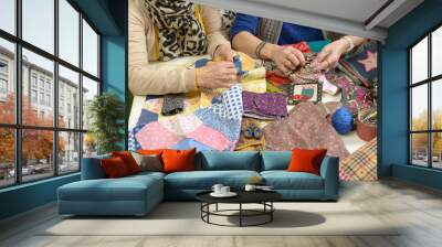 two women working on their quilting Wall mural