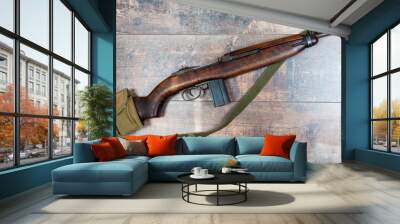 Vintage military m1 carbine rifle, with a two clip pouch on the stock Wall mural