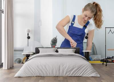 Woman doing DIY work at home Wall mural