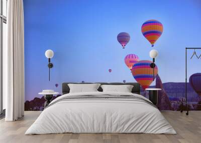 Low angle view of hot air balloons above spectacular volcanic landscape of Cappadocia. Goreme national park. UNESCO World Heritage site. Nevsehir province, Turkiye Wall mural