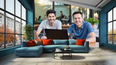 Two busy professional executive team business people working together smiling looking at computer at cafe meeting. Professional manager consulting corporate client using laptop, Wall mural