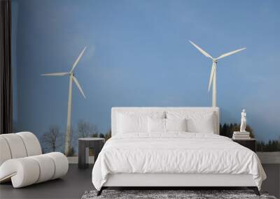 two wind turbines in wintery landscape Wall mural