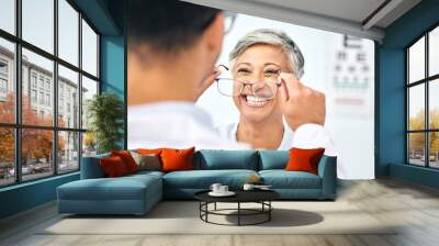 Consulting, optometry and glasses with old woman and doctor for eye care, medical and lens. Healthcare, ophthalmology and vision with senior patient in clinic for exam, eyesight and prescription Wall mural