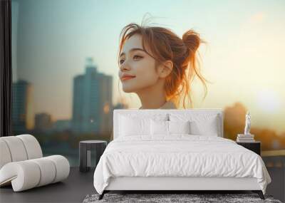 A serene portrait of a woman enjoying a sunset in an urban setting, embodying peace and tranquility. Wall mural