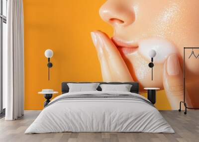 Teenage girl with acne on her cheeks, using a gentle facial cleanser Wall mural