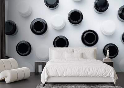 Flatlay of cosmetic jars arranged in a grid pattern on a white background, minimalist and sleek design, top view Wall mural