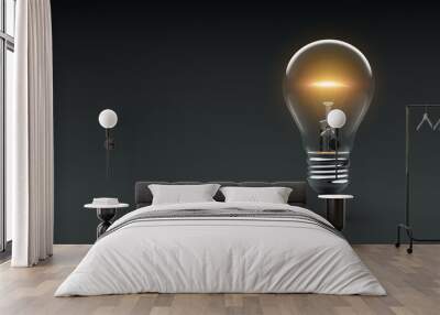 Glowing light bulb on dark background Wall mural