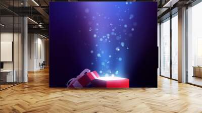 Red open gift box with magical light Wall mural