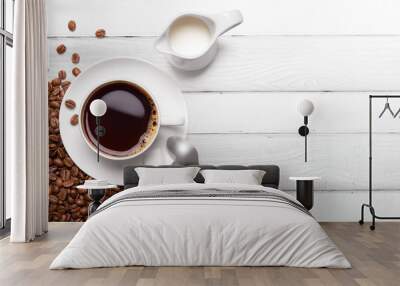 Roasted coffee beans and cup of black coffee Wall mural