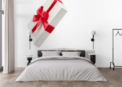 White gift box with red bow isolated on white background - Clipping path included Wall mural