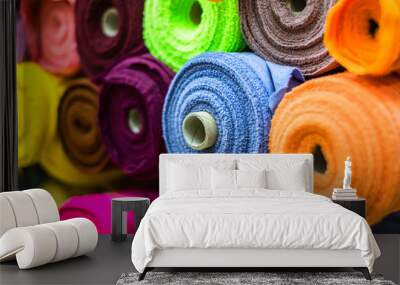 Colorful of many fabric rolls selling in market stall shop. Fashion desig concept. Wall mural